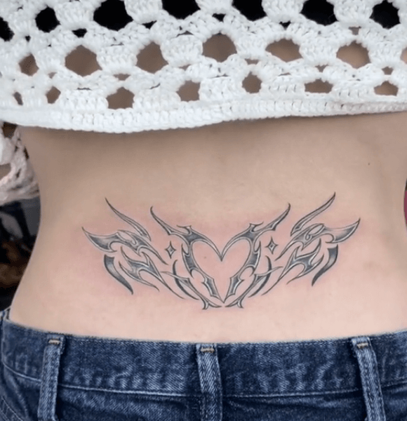 18. Heart With Flames Lower Back Tattoo