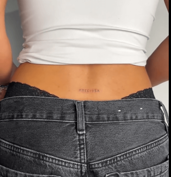 21. Custom Initials Tramp Stamp Tattoo