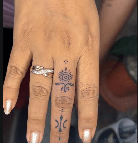 Small evil eye tattoo