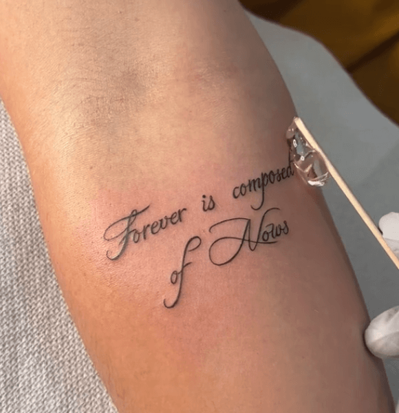 "Forever is composed of nows." tattoo on the hand