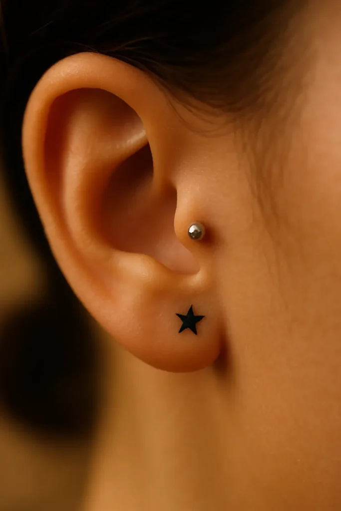 2. Tragus Piercing + Star tattoo