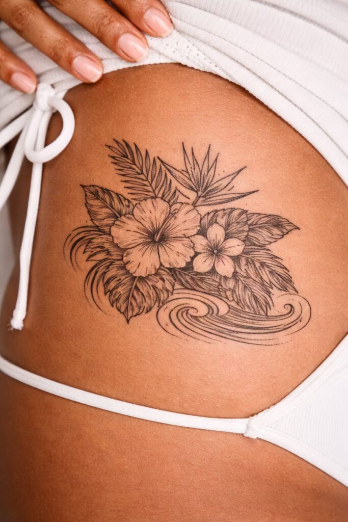 8. Tropical Japanese Floral Hip Tattoo